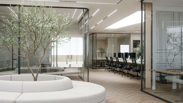Atrium with an olive tree and glass-walled offices at Oh My Desk Downtown Dubai, thumbnail for the UAE e-invoicing timetable