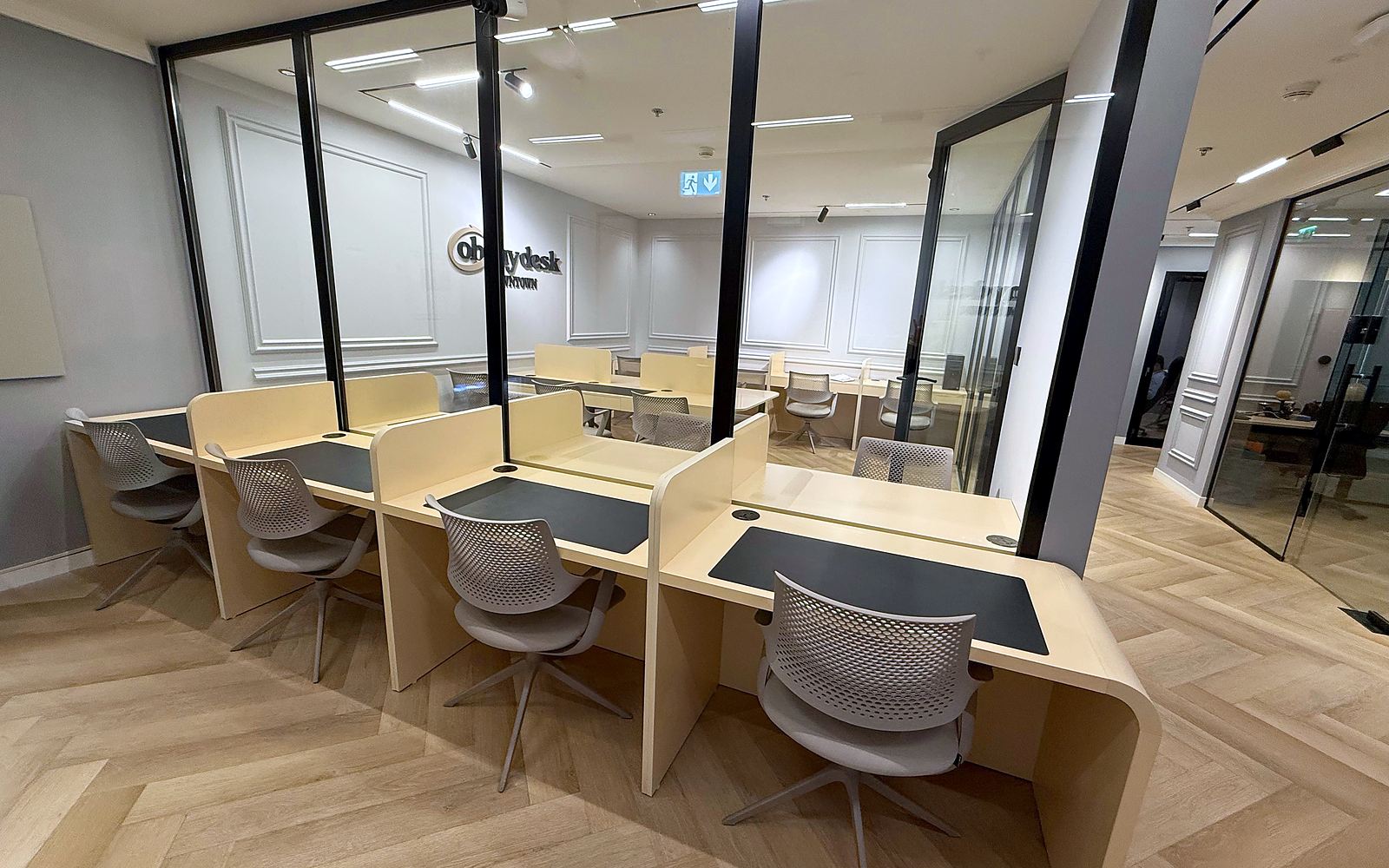 The flexible desks at Downtown, behind the glass wall